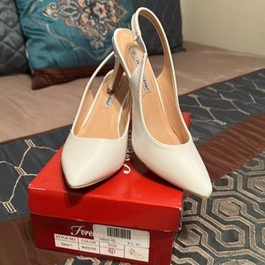 Barely worn white patent leather white pumps